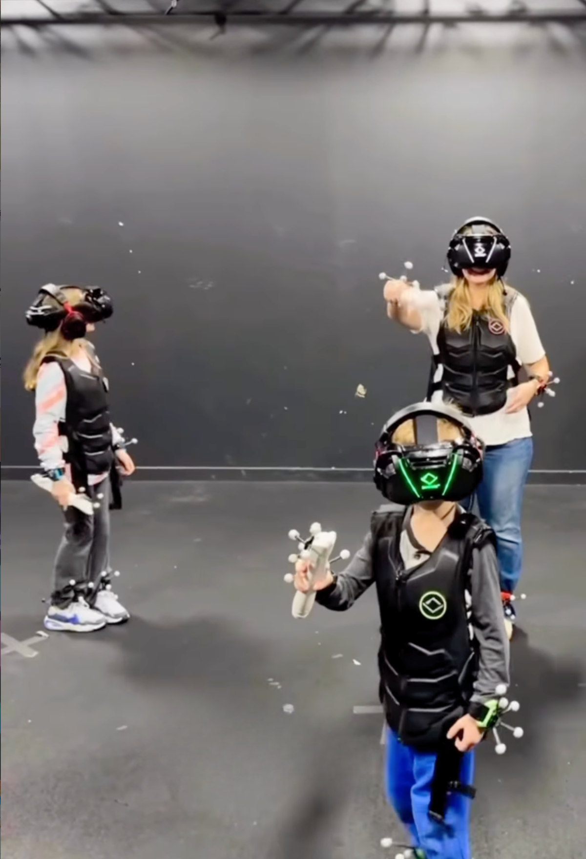 Macaroni KID Wheaton publisher Erica Alhorn and kids try VR at Sandbox. Image from Instagram