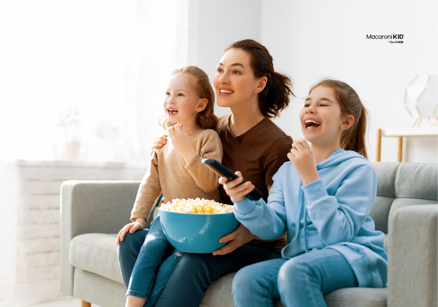 Mom and kids watching family movie at home